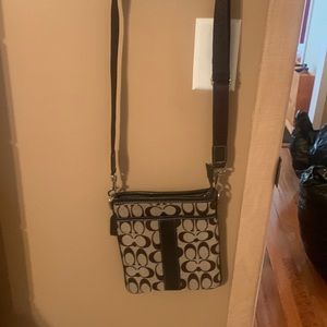 Coach brown C logo.  Used
